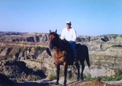 Dennis sitting on a horse
