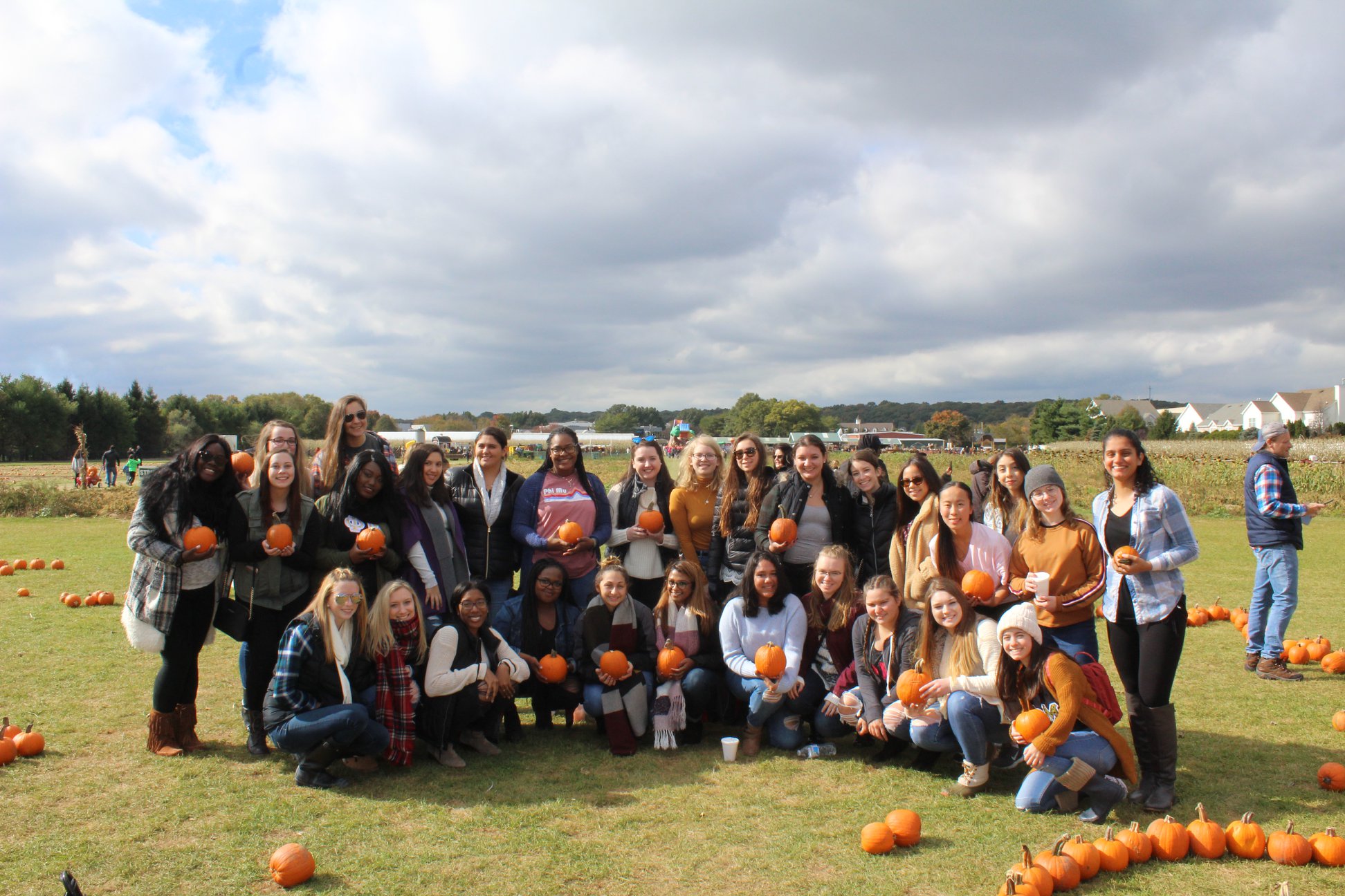 Sisters pumpkin picking